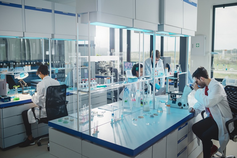 Scientists working in a modern lab, symbolizing fluoropolymer R&D from PTFE discovery to today’s custom amorphous fluoropolymers.